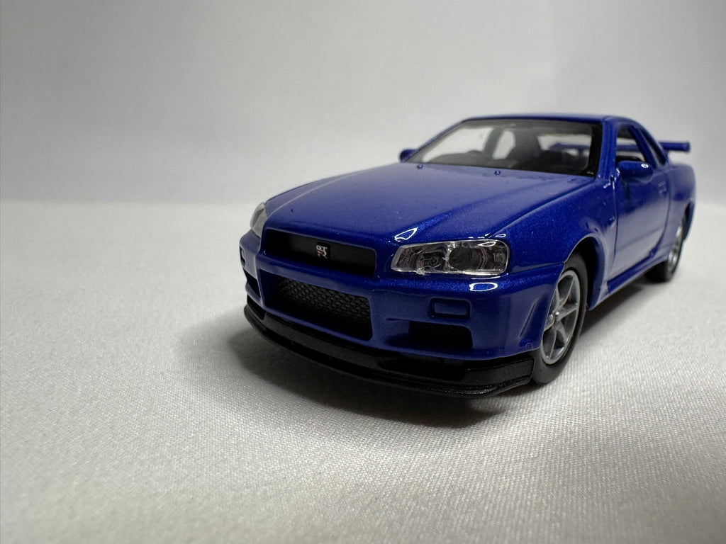 1:34 Welly Nissan Skyline GT-R R34 Blau #191