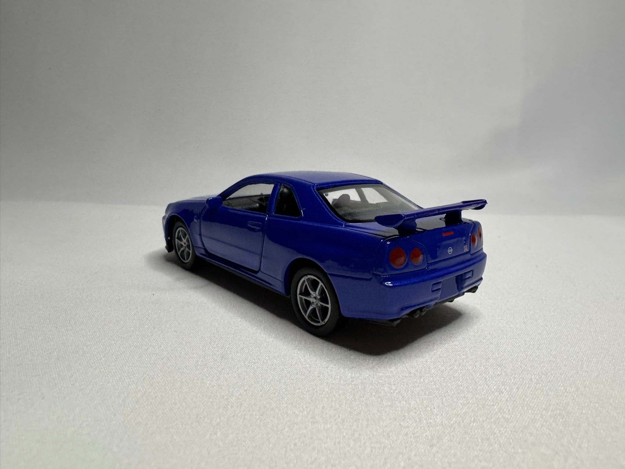 1:34 Welly Nissan Skyline GT-R R34 Blau #191