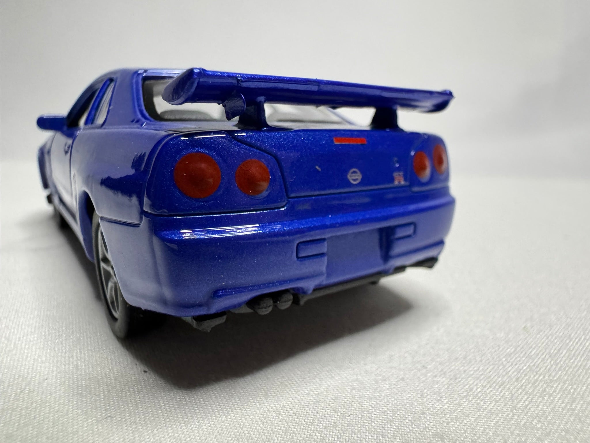 1:34 Welly Nissan Skyline GT-R R34 Blau #191