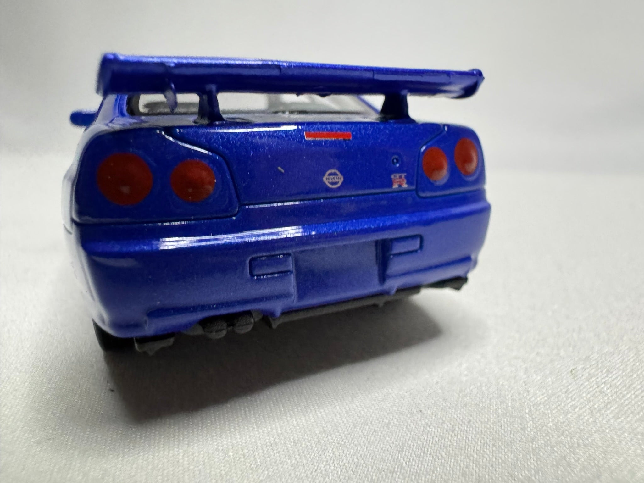 1:34 Welly Nissan Skyline GT-R R34 Blau #191