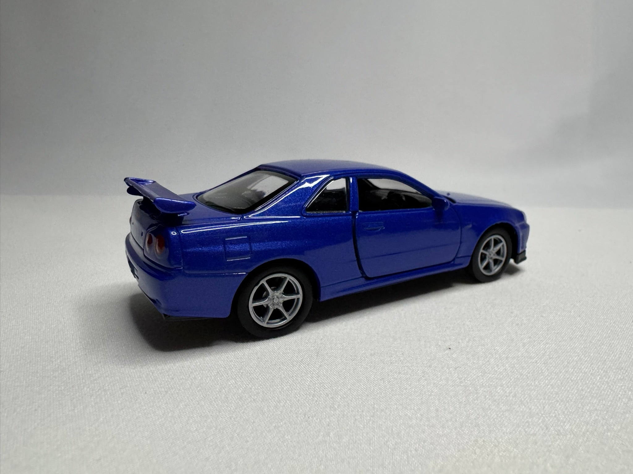 1:34 Welly Nissan Skyline GT-R R34 Blau #191