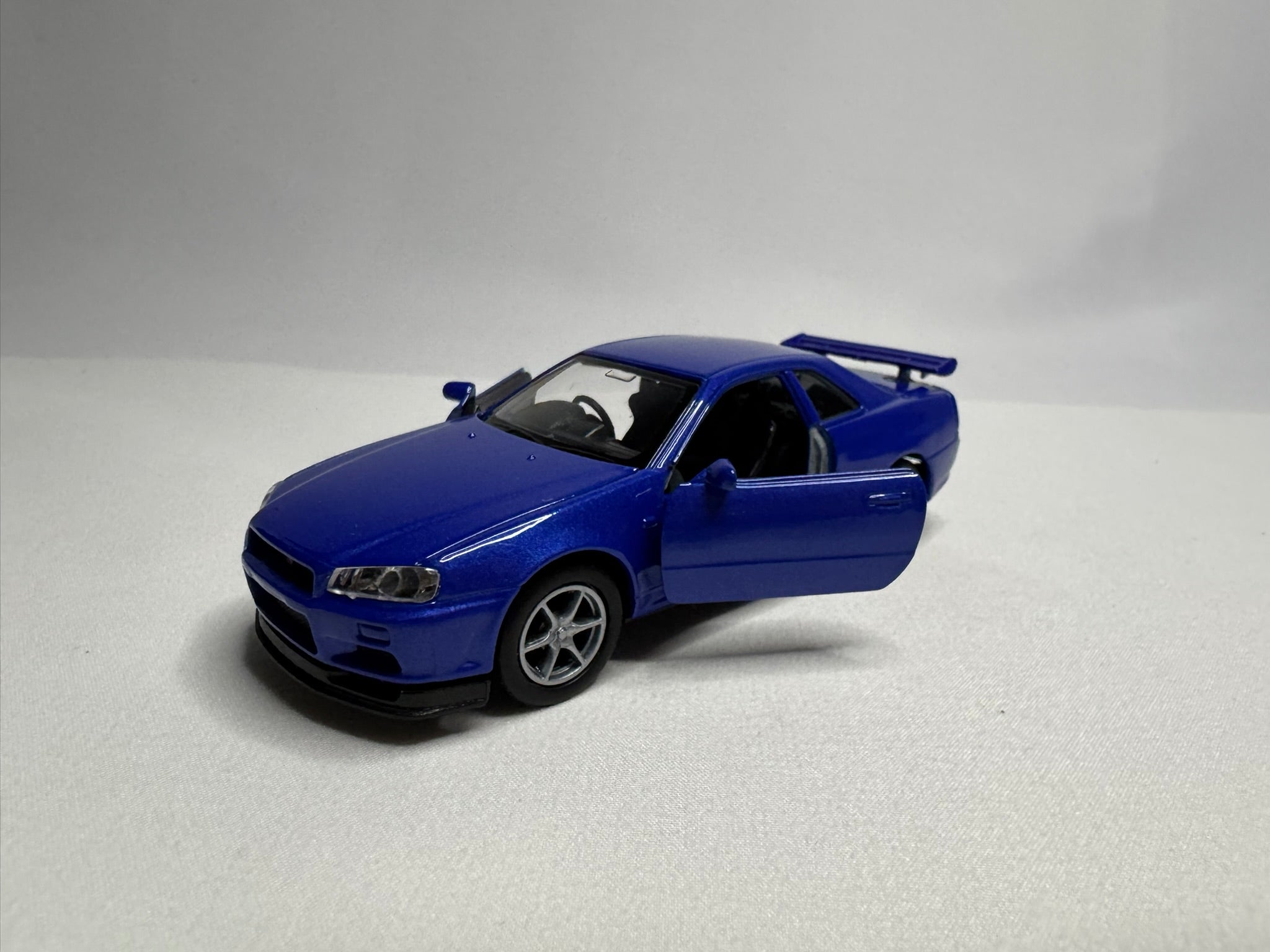 1:34 Welly Nissan Skyline GT-R R34 Blau #191